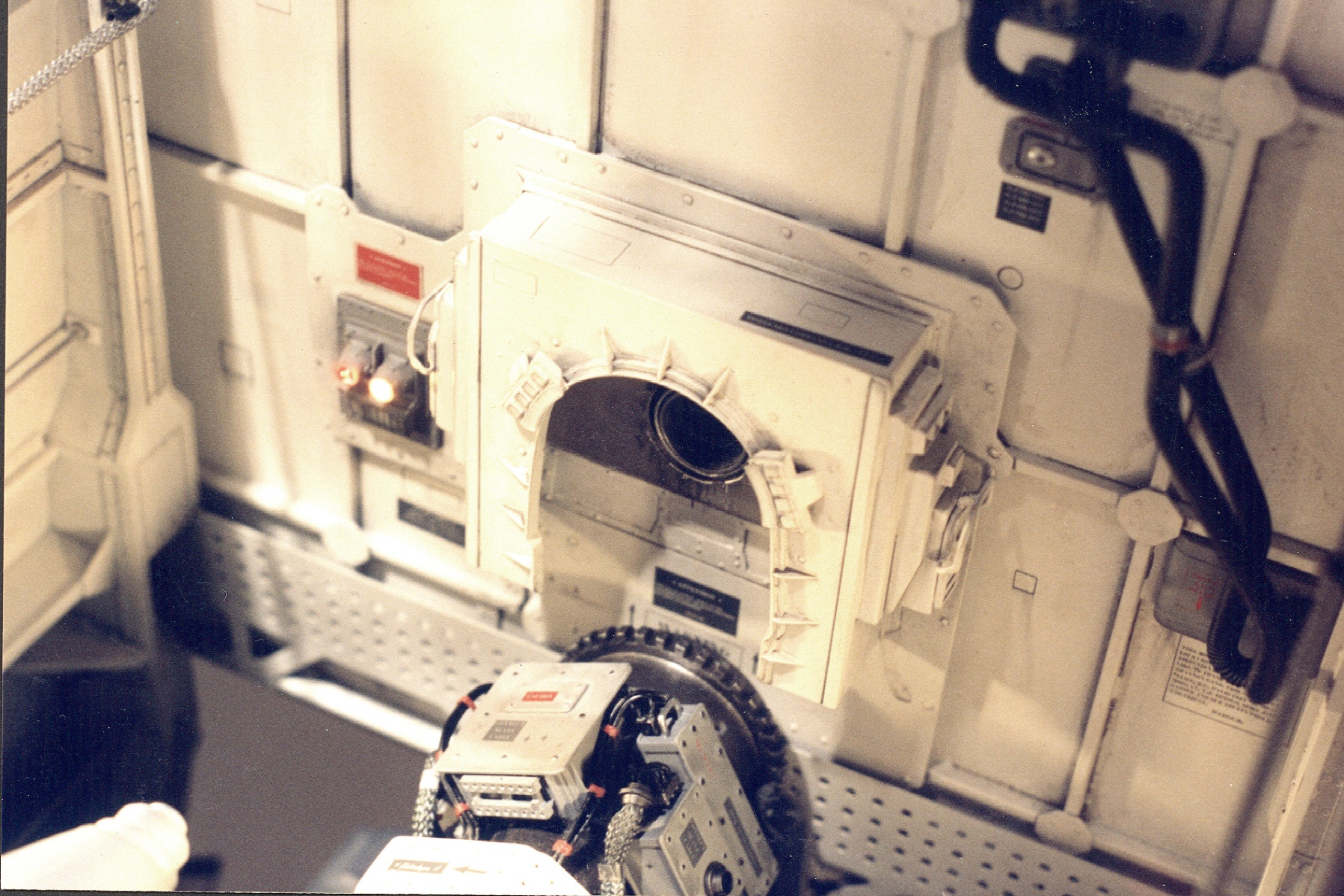 Miniature bomb-bay interior built for John Woo's Broken Arrow — open hatch, weathered placards, hero device in foreground
